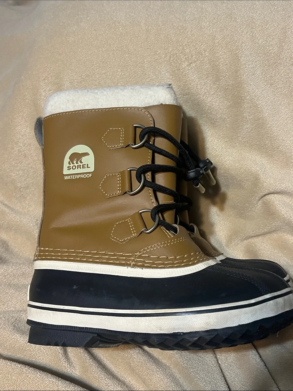 Sorel kids Tan and Black Waterproof Snow Boot with White Fleece Cuff- size 1